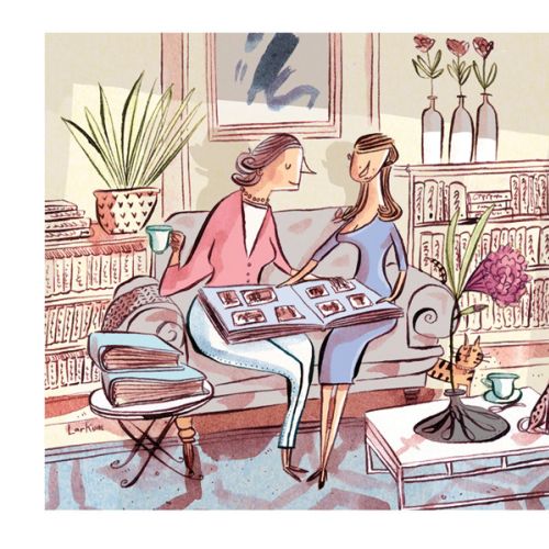 Two women on couch looking at photo album in living room by Adam Larkum