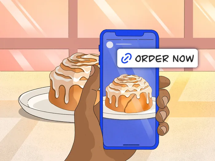 Hand holding phone displaying cinnamon roll with order now button