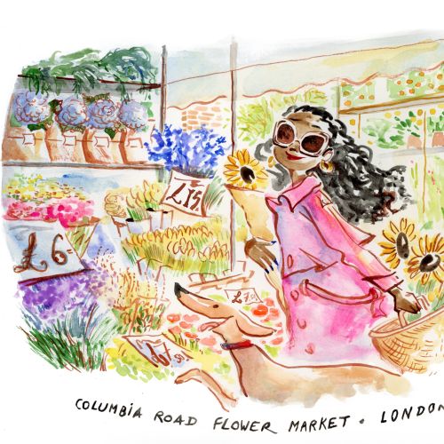 Woman with sunglasses at Columbia Road Flower Market holding sunflowers