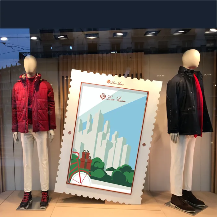 Mannequins wearing red and black jackets in a store window display
