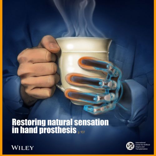 Human hand holding metallic prosthetic hand with steaming mug