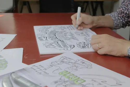 Hands drawing detailed sketches on paper by Alexander Roncaldier