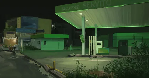 Empty green gas station at night near quiet road
