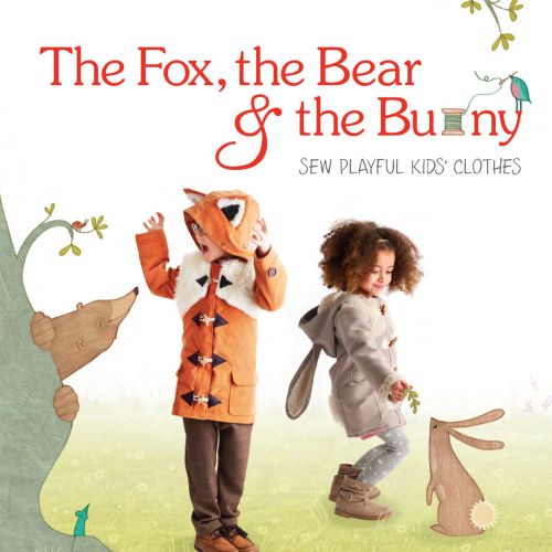 Kids wearing fox and bunny costumes standing with animal illustrations