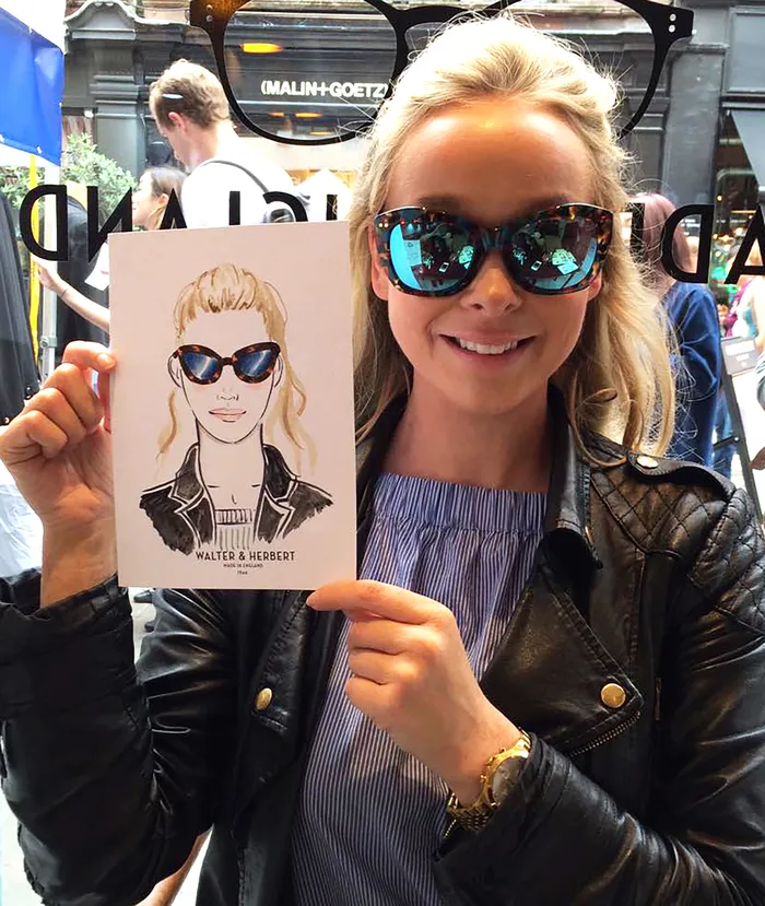 Radiant subject presenting her live portrait artwork