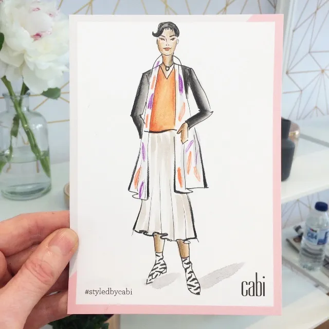 Live painting of a Cabi shopper at the event"