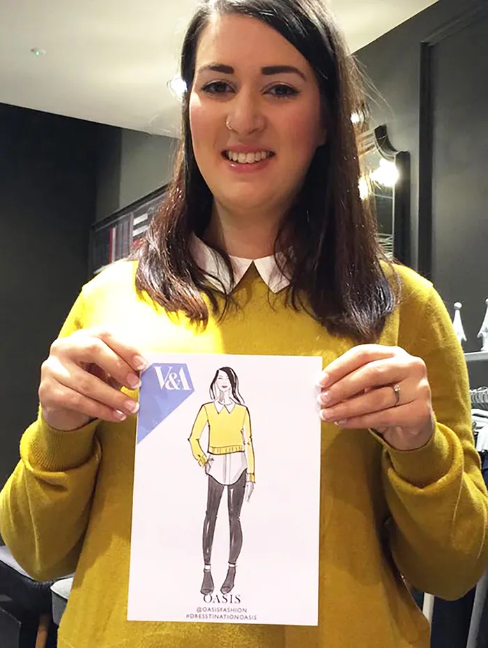Girl showcasing a fashion sketch from the Oasis live event
