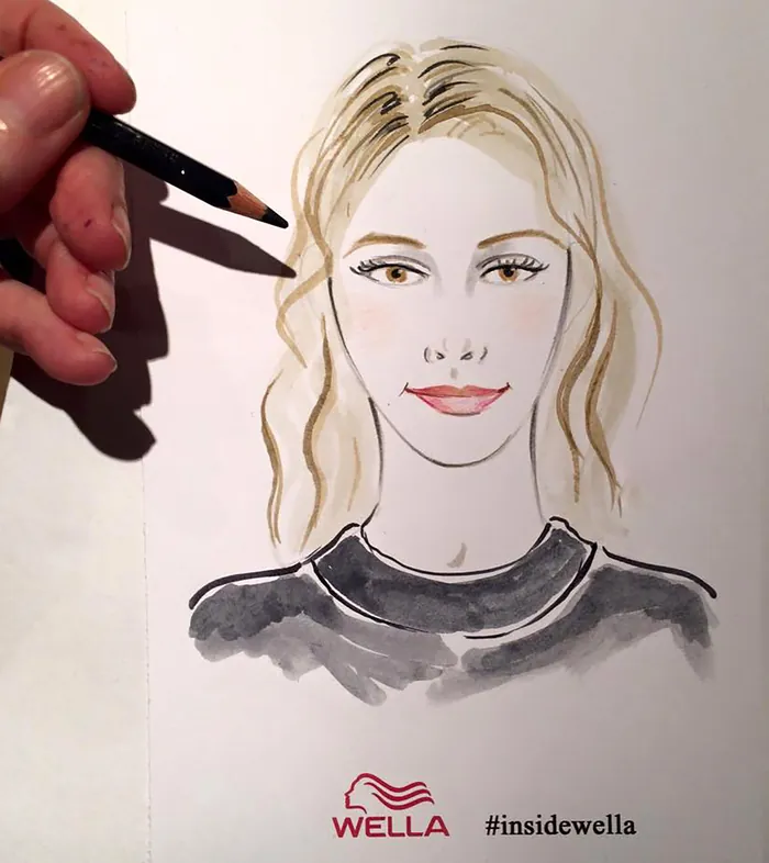 Hand drawing a portrait of a woman with blonde hair at Wella event