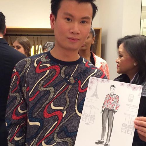 Man with fashion sketch at live event