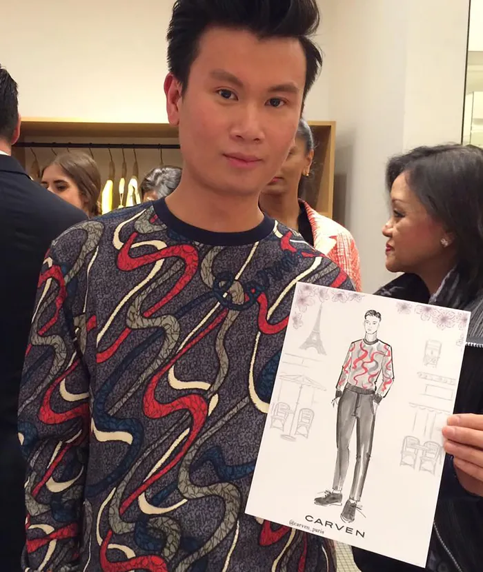 Man with fashion sketch at live event