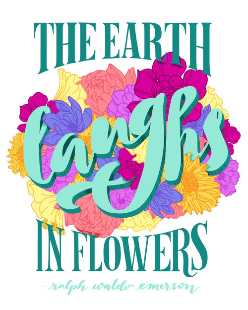 Le lettrage floral de la terre rit dans les fleurs