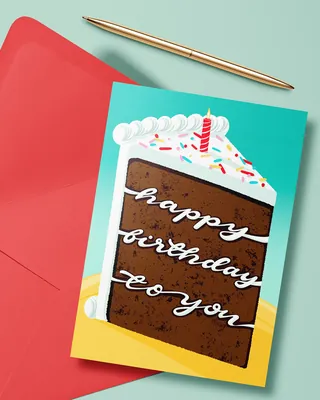 Birthday card with chocolate cake and candle, red envelope, gold pen