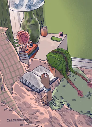 Individual reading a book lying on a bed with green walls and nightstand