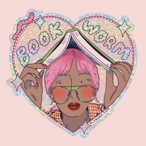 Person with pink hair and glasses reading book titled Book Worm