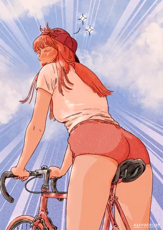 Woman on bicycle with sunlit sky background