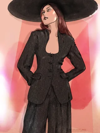 Woman wearing black suit and large black hat posing confidently