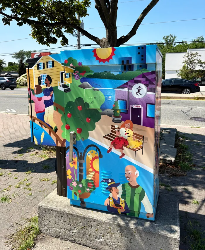 Mural of lakeside village scenes with people, nature, and landmarks by Alyah Holmes