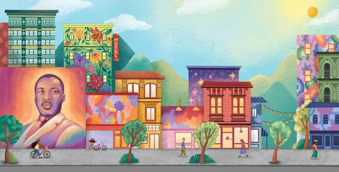 City street mural featuring a portrait and colorful decorated buildings
