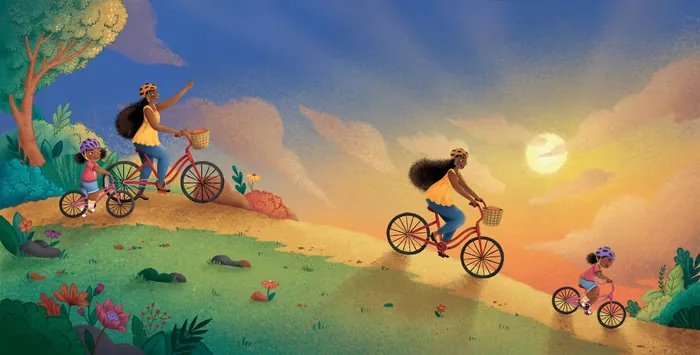 Family riding bicycles on a hill during a sunset