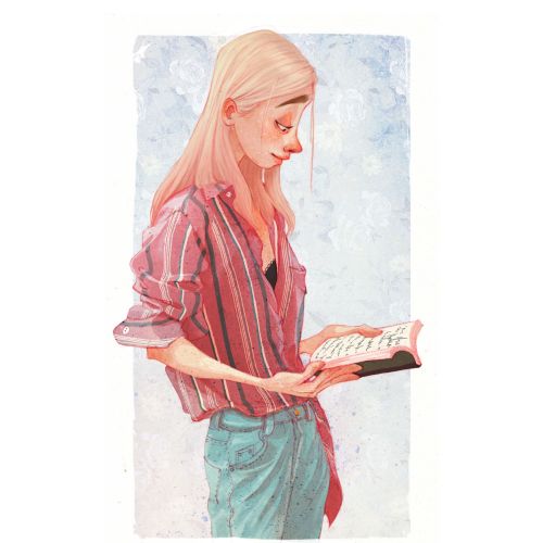Young woman with blonde hair reading a book in casual outfit
