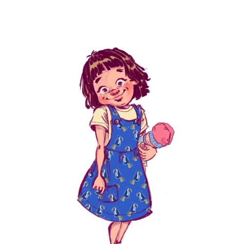 Smiling girl in blue dress holding pink ice cream cone