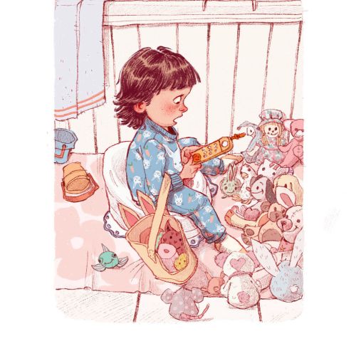 Child in blue pajamas playing toy guitar with stuffed animals nearby