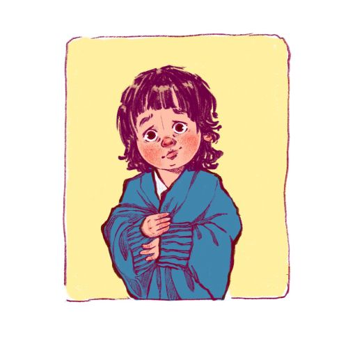 Shy child with dark hair wearing a large blue sweater