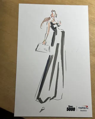 Fashion illustration of a woman in a long black and white dress holding a handbag