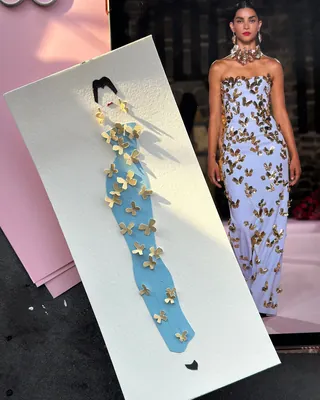 Paper art fashion illustration of blue dress with butterflies