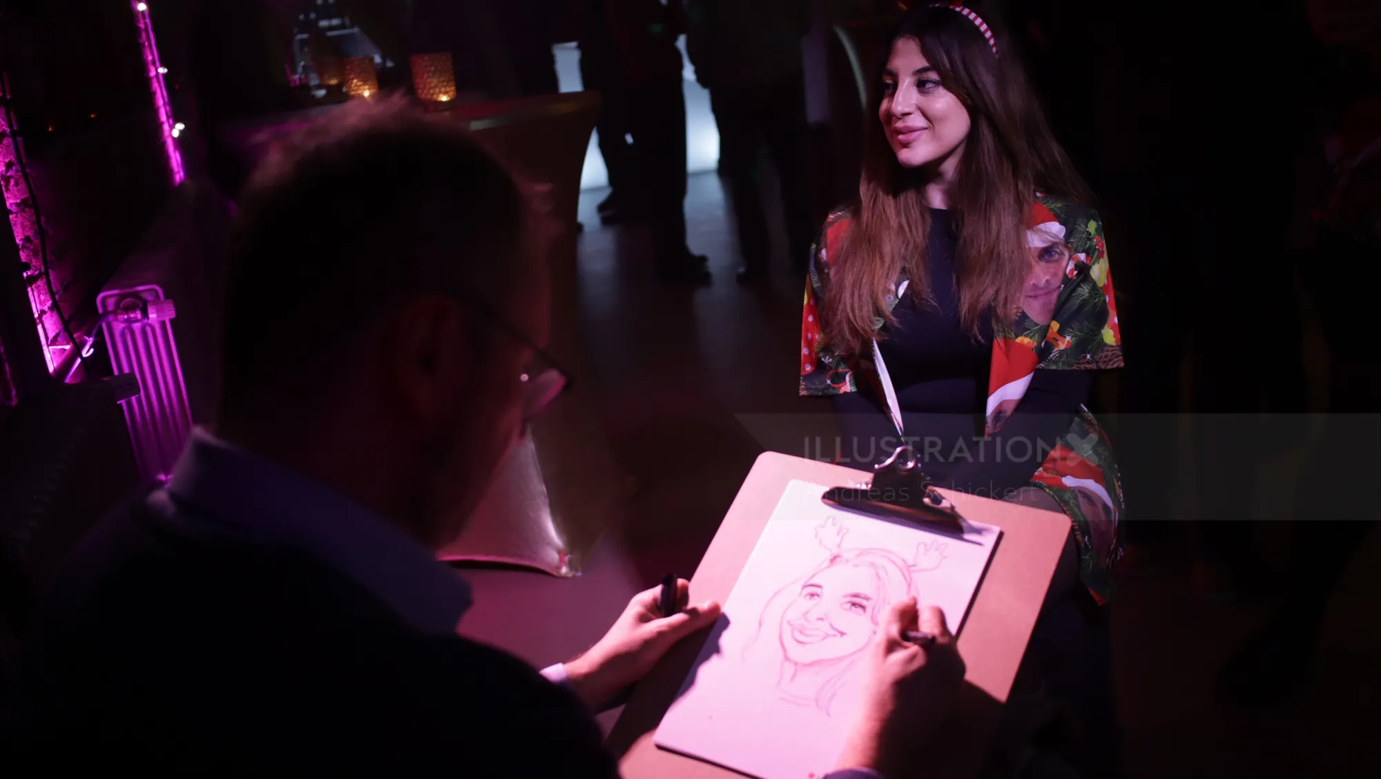 Artist drawing a woman's portrait in a dark room with purple lights