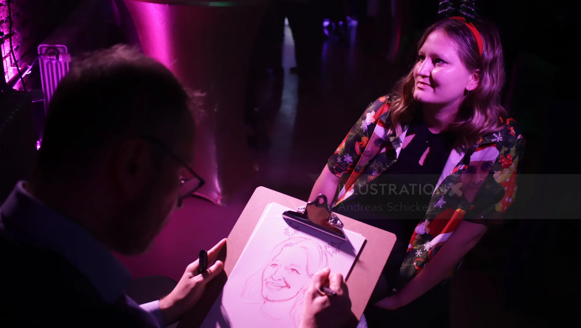 Artist drawing a woman's portrait with soft purple lighting