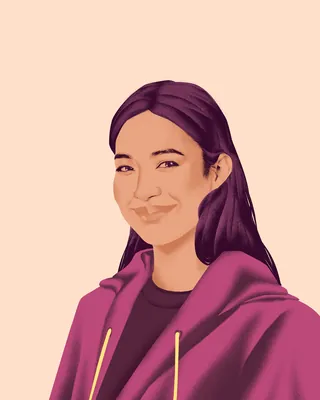 Smiling woman with long dark hair in maroon hoodie on light background