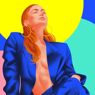 Woman in blue suit with large hoop earrings against colorful abstract background