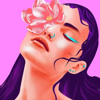 Woman's face with pink flower covering eye and bright makeup on pink background