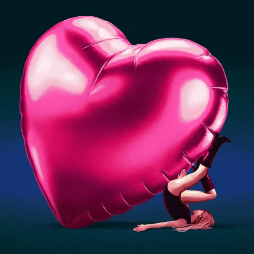 Woman lying down holding large pink heart balloon