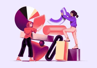 Two women arranging colorful abstract shapes and pie chart elements