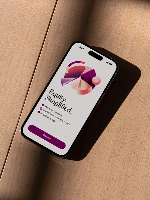 Smartphone showing equity finance app screen on wooden table by Andrei Nicolescu