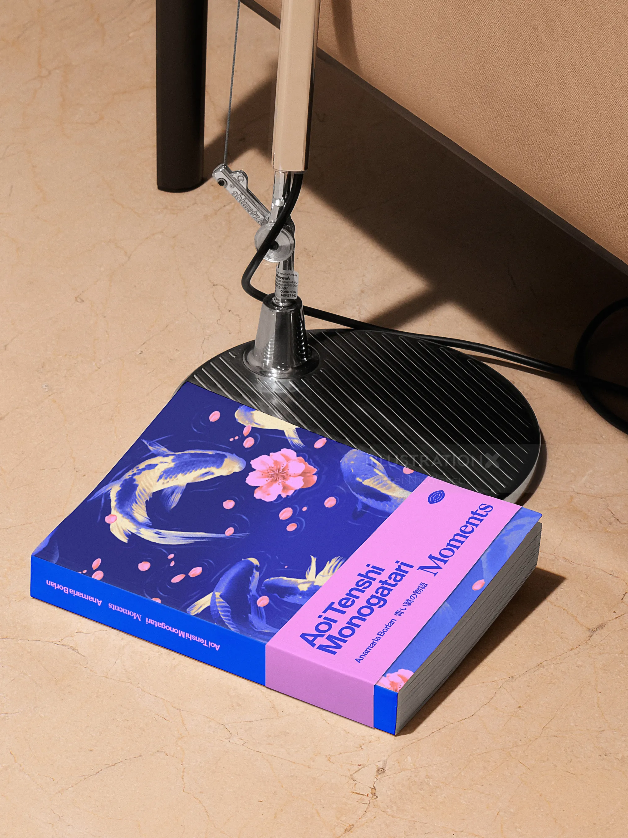 Book titled Abstract Moments beside a desk lamp on the floor by Andrei Nicolescu