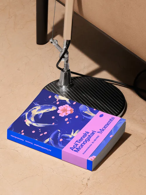 Book titled Abstract Moments beside a desk lamp on the floor by Andrei Nicolescu