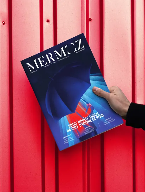 Hand holding Mermoz magazine with abstract blue cover by Andrei Nicolescu