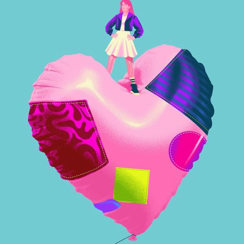 Woman standing on a decorated heart-shaped balloon by Andrei Nicolescu
