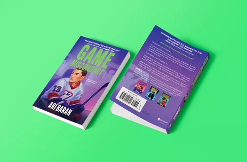 Open purple book photographed by Andrei Nicolescu on a bright green background