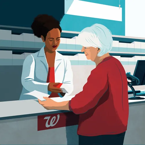 Pharmacist assisting elderly woman at Walgreens counter