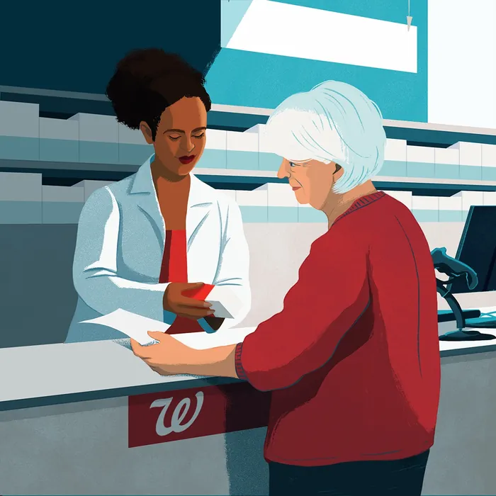 Pharmacist assisting elderly woman at Walgreens counter