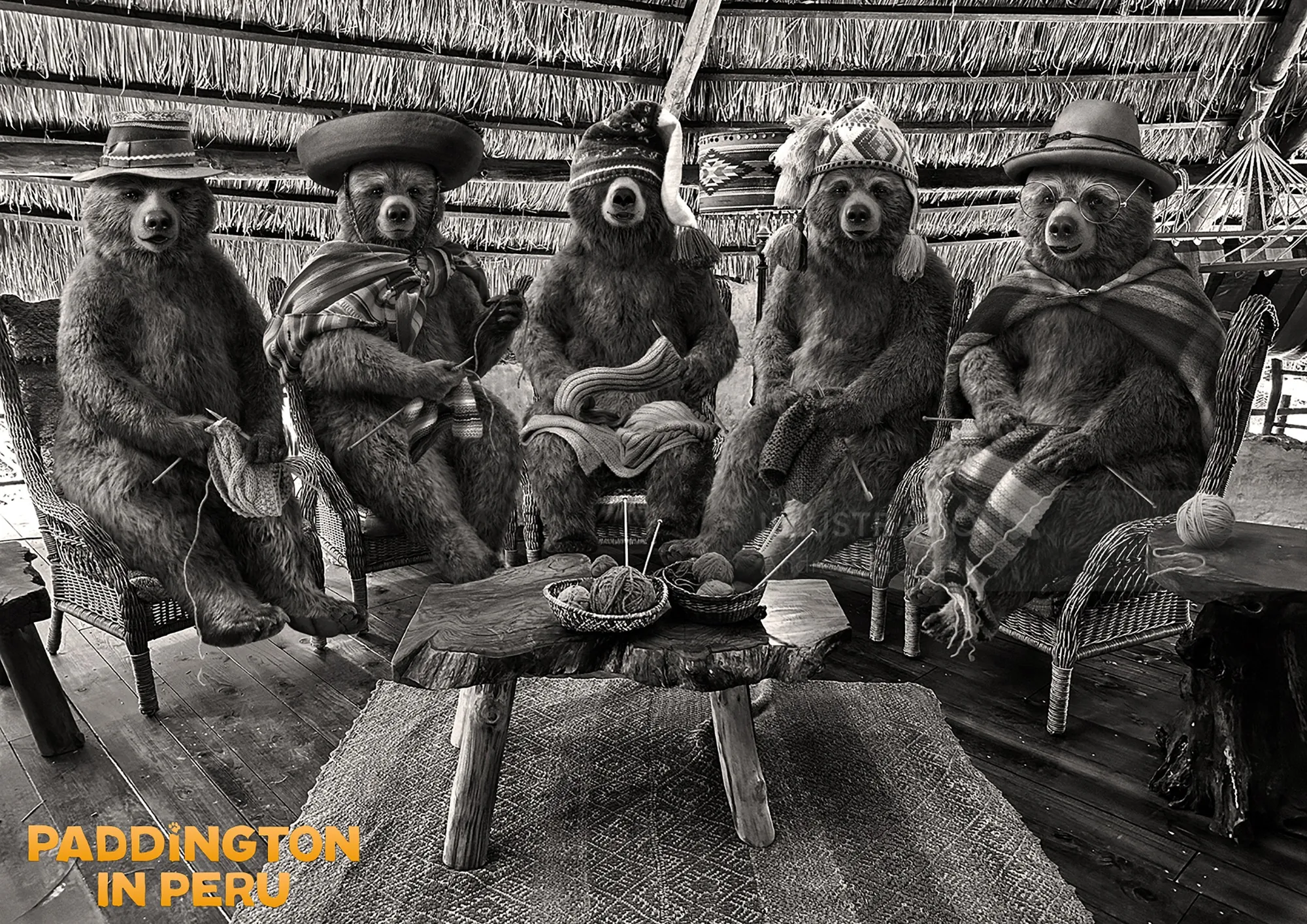 Bears in traditional Peruvian outfits sitting around a wooden table indoors.