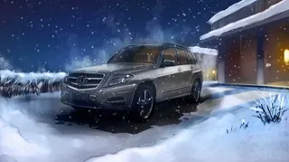 Mercedes SUV parked in snow outside house at night by Andriy Vynogradov