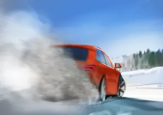 Red car drifting on a snowy road, kicking up snow, by Andriy Vynogradov.