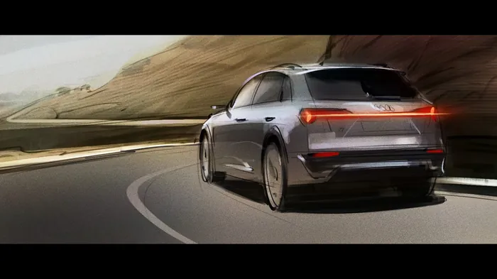 Silver electric car driving on mountain road by Andriy Vynogradov