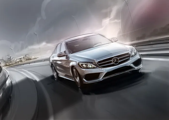 Mercedes-Benz sedan speeding on wet highway during storm by Andriy Vynogradov