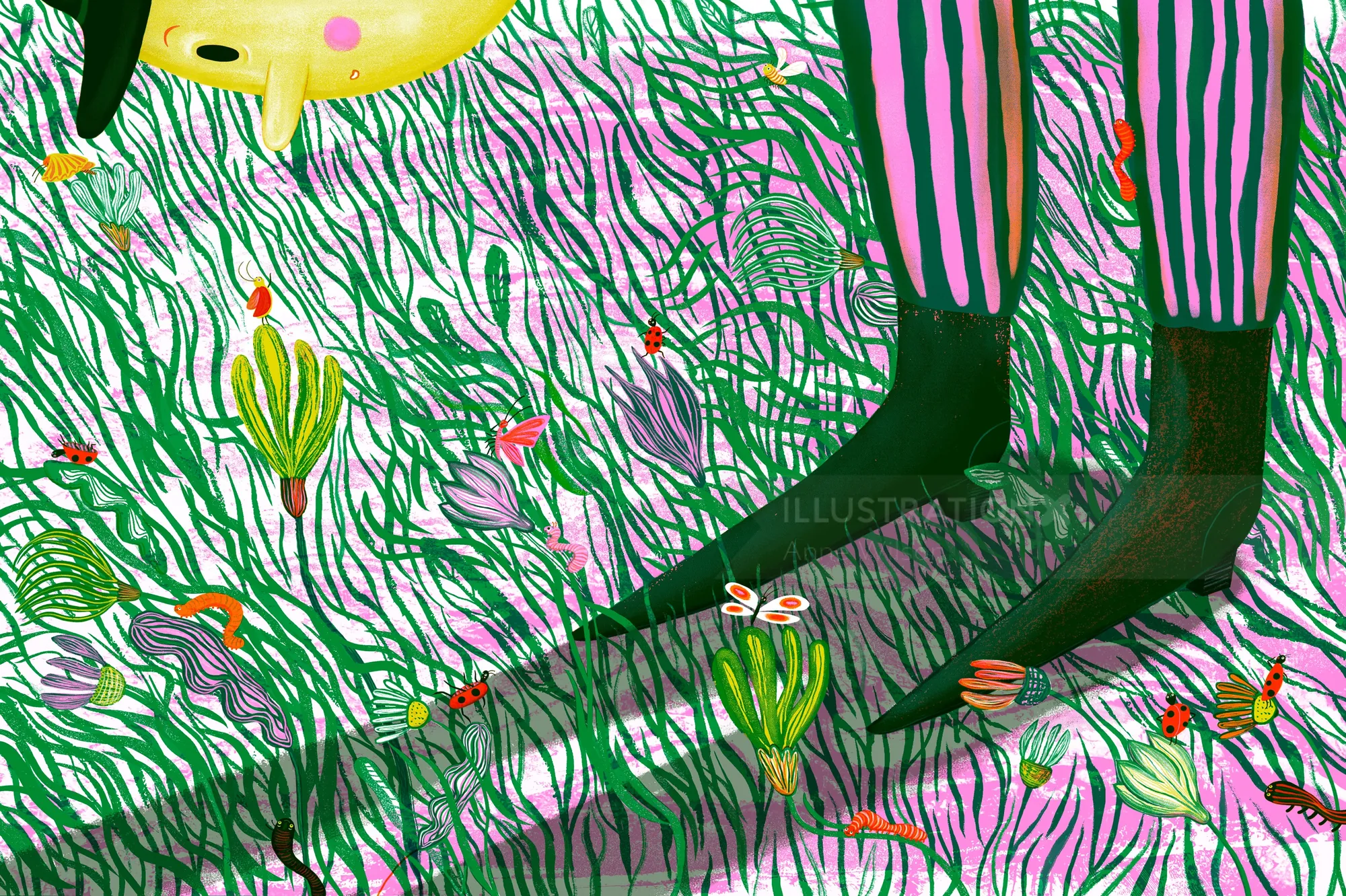 Child's legs in striped pants standing in grass with colorful flowers